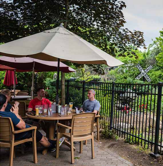 Cold Spring Depot outdoor patio with railroad crossing sign